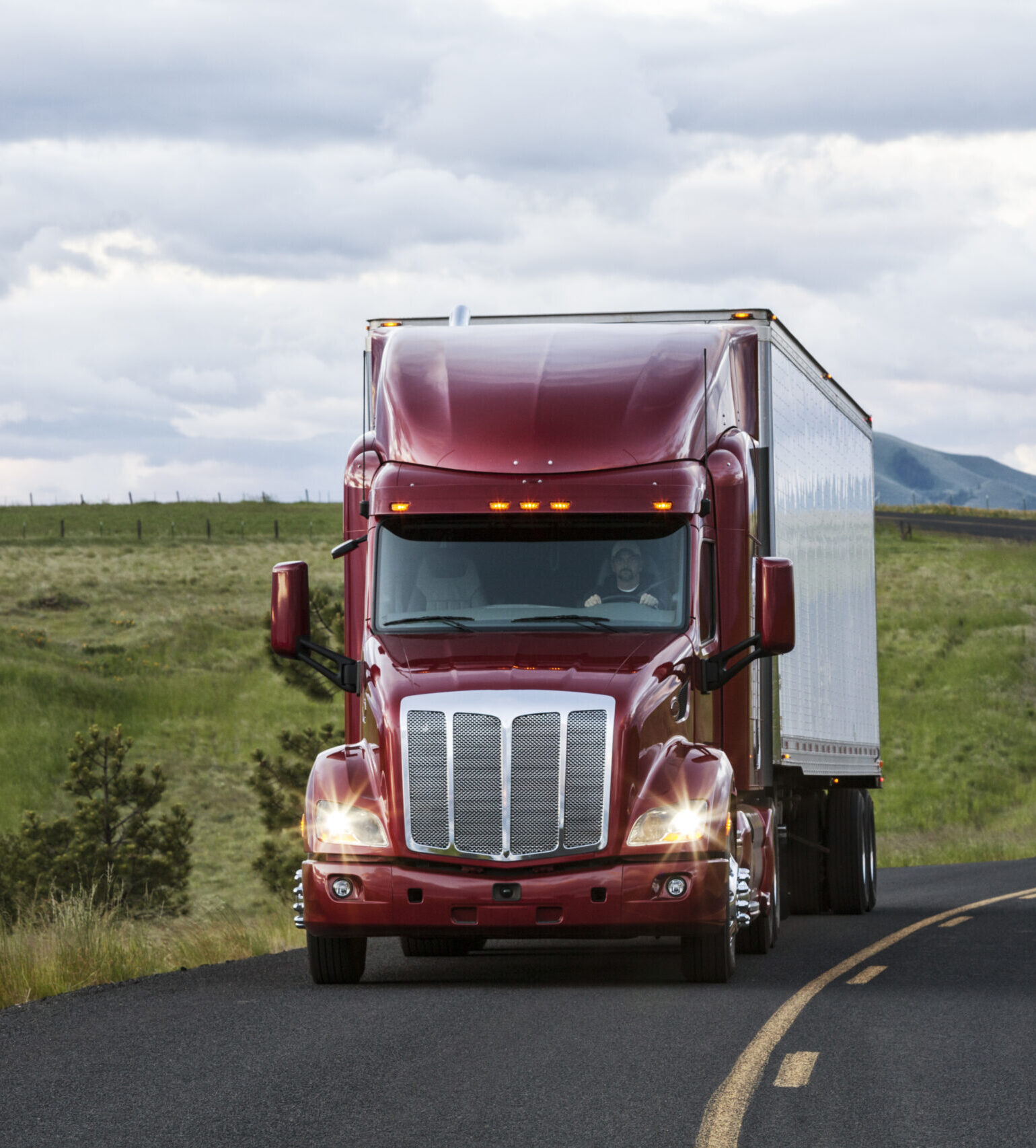 truck on a highway through the grasslands area of eastern Washington, USA.